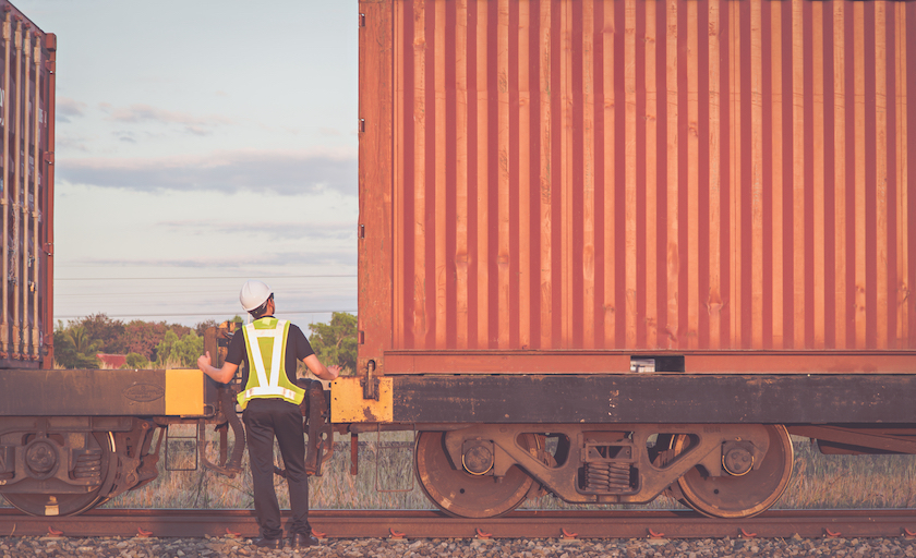 worker looking at a train